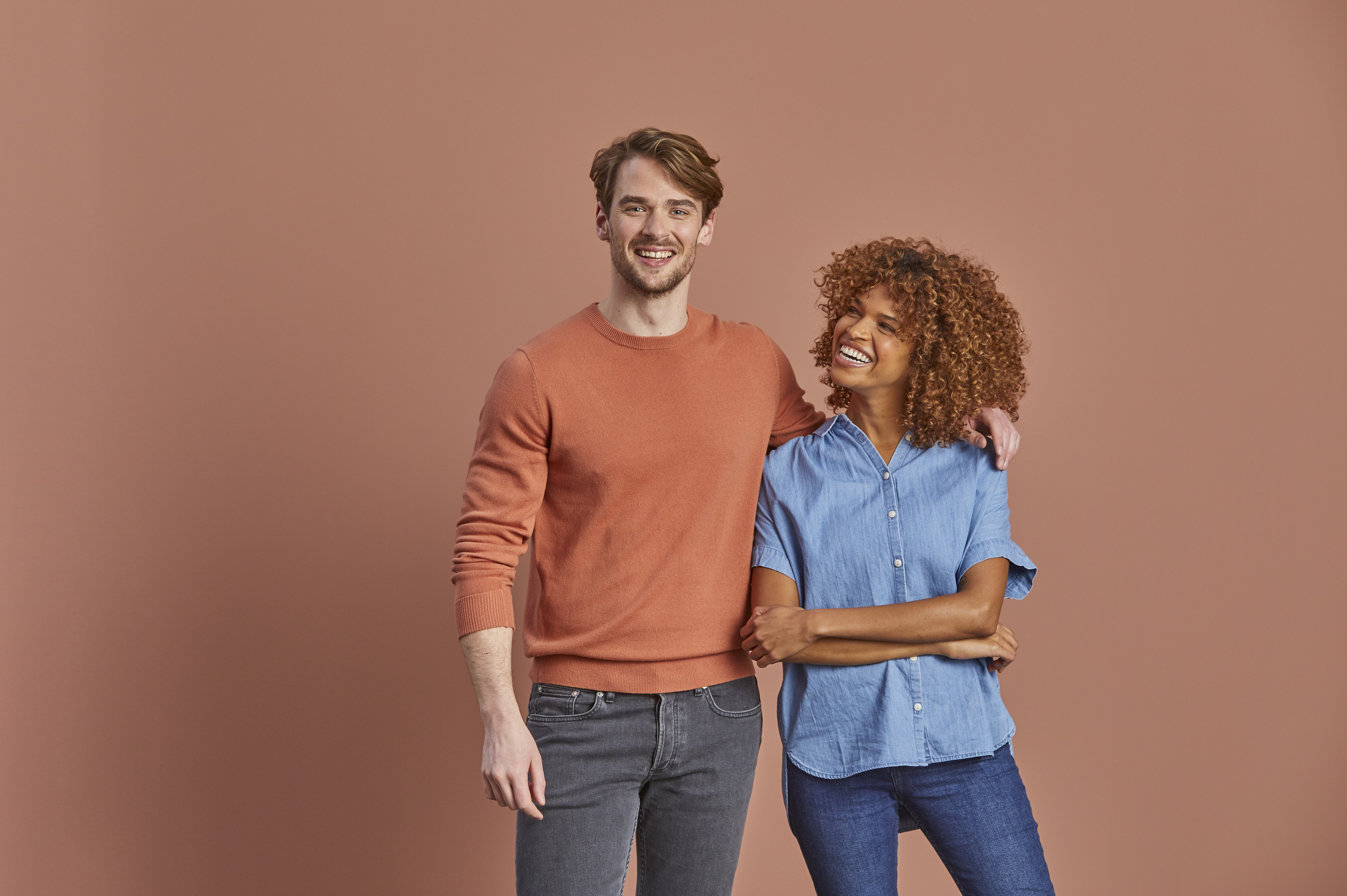 Two people on blush background photo by ROOM