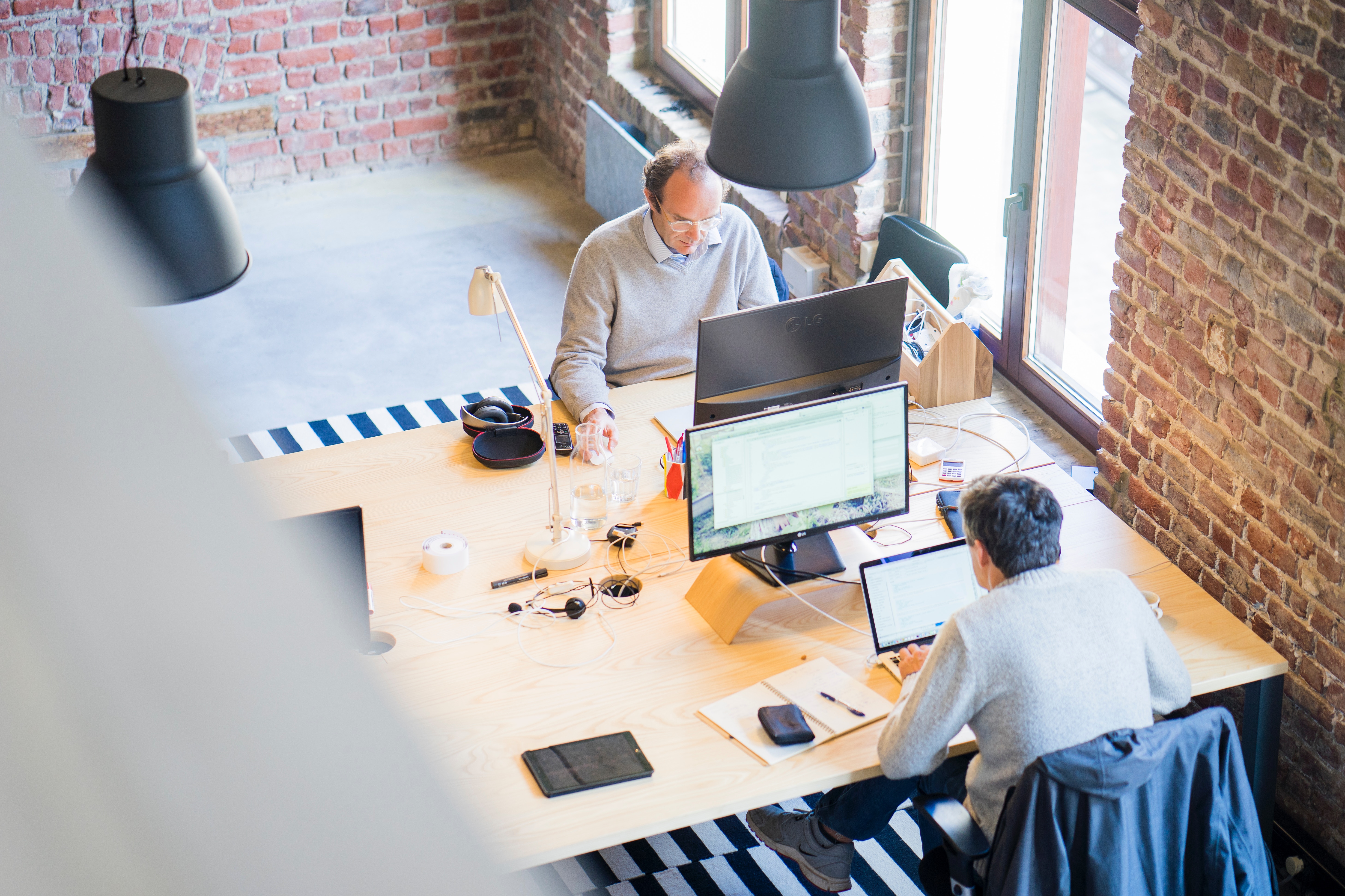 two workers in open office