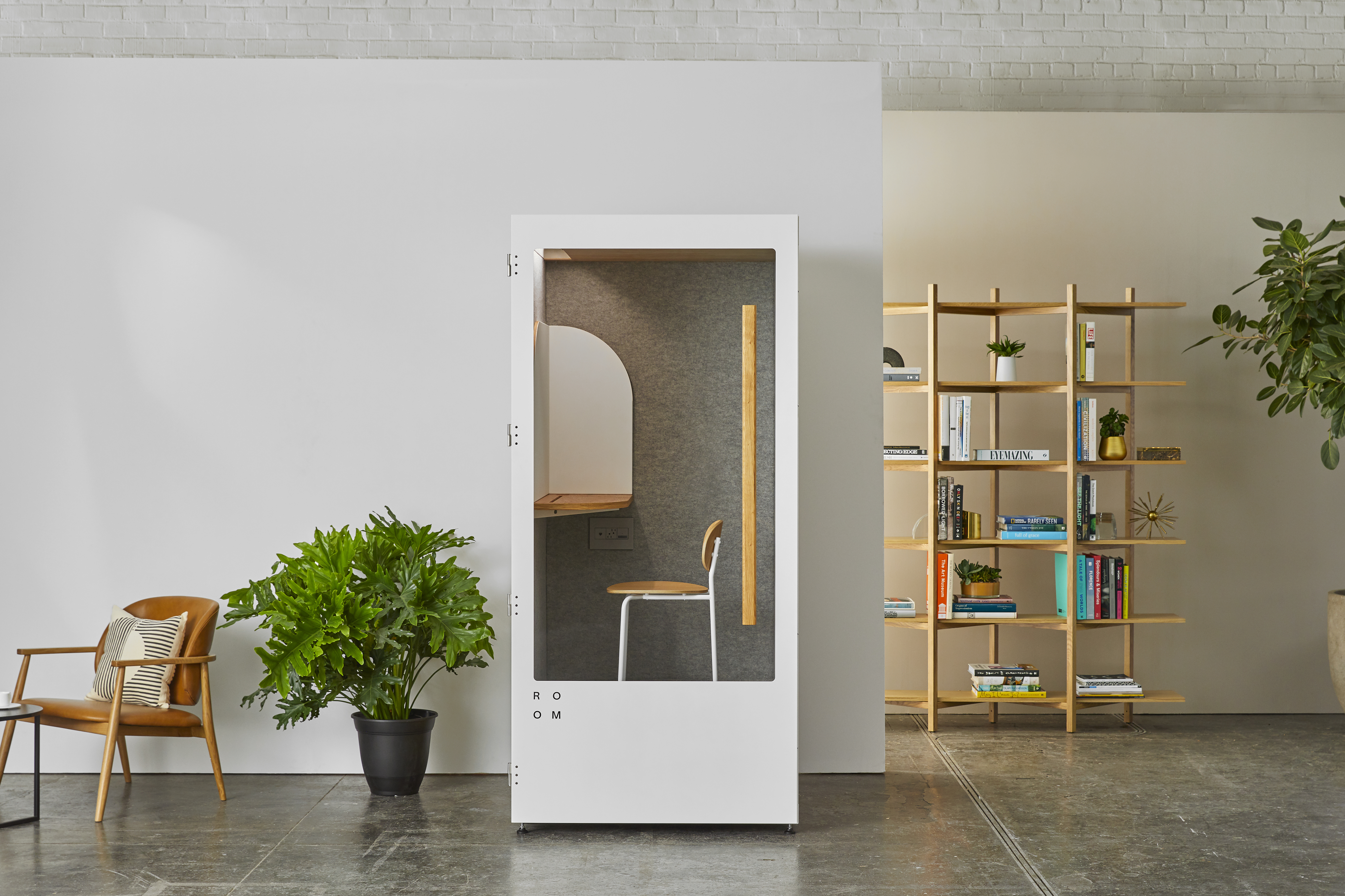 White ROOM brand phone booth in an office environment